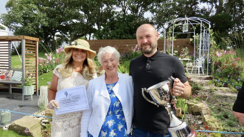 The Now And Then show garden created by Paul and Jane Joughin of Absolutely Splashing won the inaugural Tim Timmerman Trophy at Southport Flower Show. The trophy was presented by Mr Timmerman's wife Shirley Timmerman. Photo by Andrew Brown Stand Up For Southport