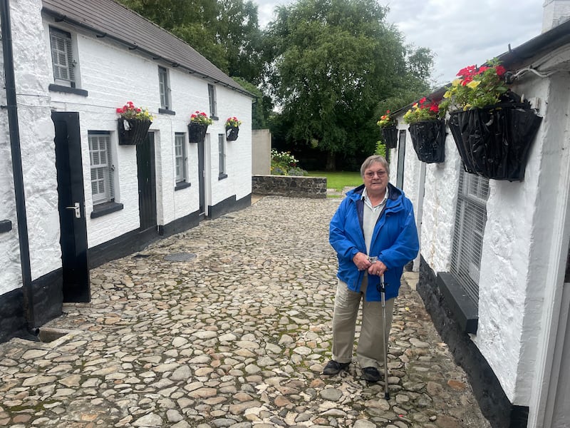 Yvonne Penpraze on the cobbled lane leading to the Irish Garden Plant Society  garden in Antrim town