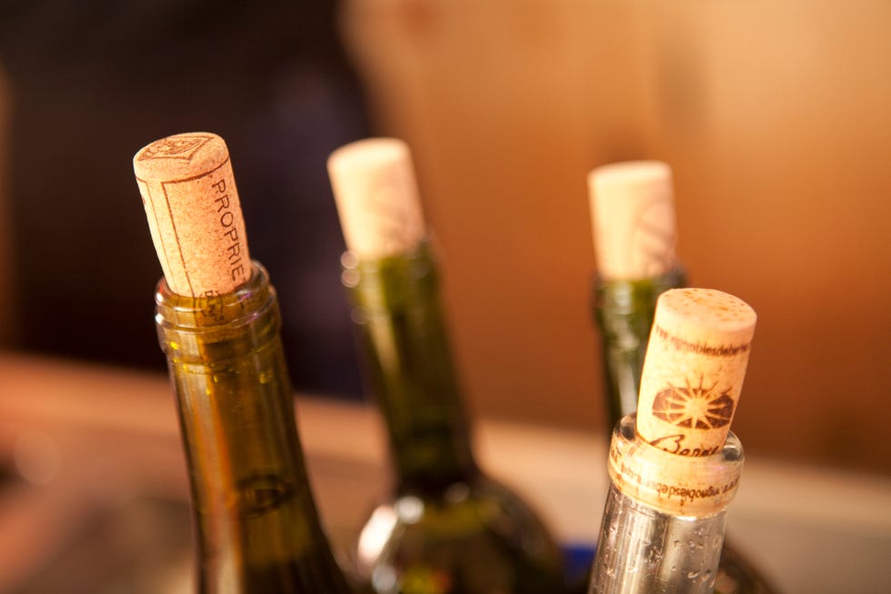 bottlenecks and corks at the counter of a wine bar in paris