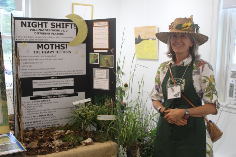 Rhonda Fowler with her display about the importance of pollinators, and how gardeners can encourage them. ASHLEY SAARI/Ledger-Transcript