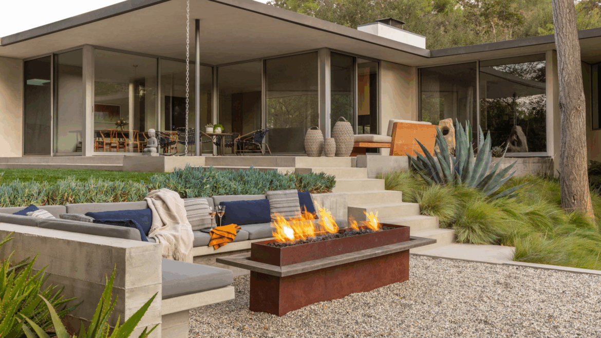 modern chic outdoor area with built-in sofa and a firepit table