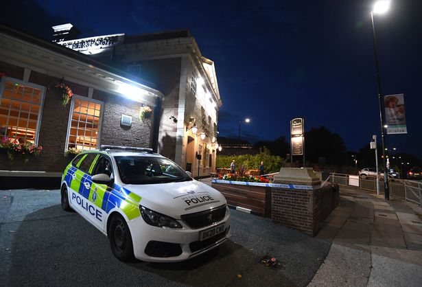 A cordon is in place outside the Barker's Brewery pub on Archway Road, Huyton