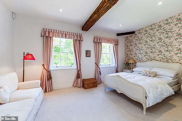 According to Savills, the farmhouse promises buyers 'beautiful Hampshire countryside views'