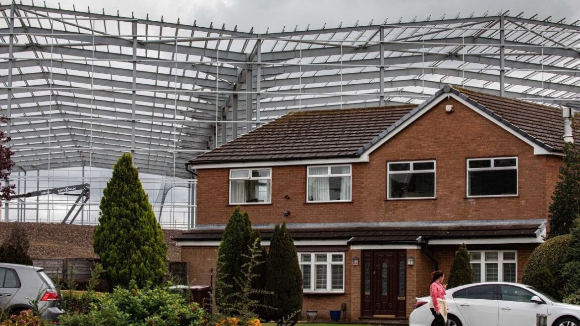 “It’s like a cruise ship in our garden”: New 60ft warehouses loom over homes | SWNS "It's like a cruise ship in our garden": New 60ft warehouses loom over homes | SWNS