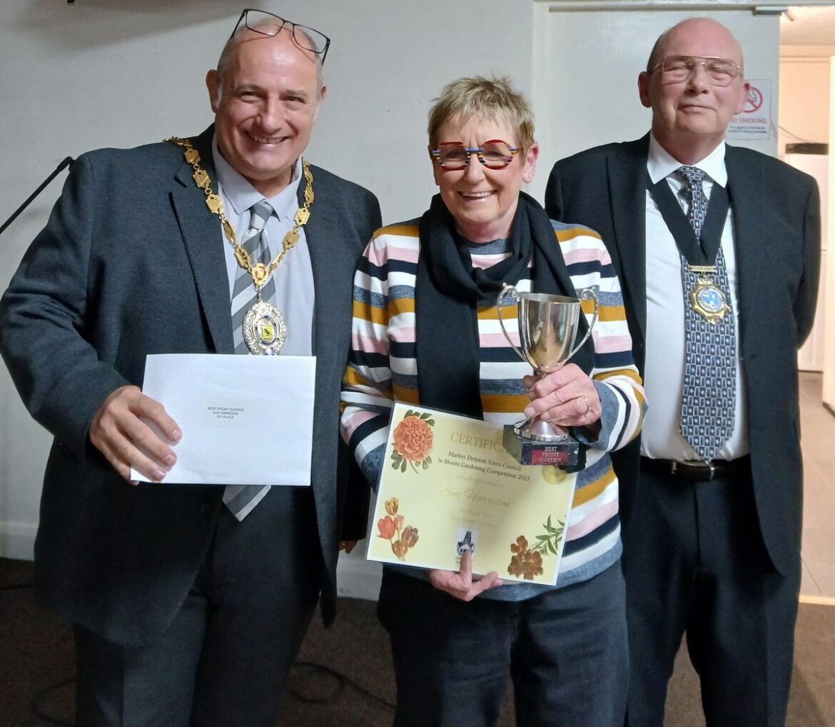 ‘The standard was mind-blowing’ – Green-fingered winners of Market Drayton bloom competition celebrated Sue Harrison took home the award for Best Front Garden. Sue (centre) received her award from Mayor Tim Manton (left) and Deputy Mayor Phil Glover