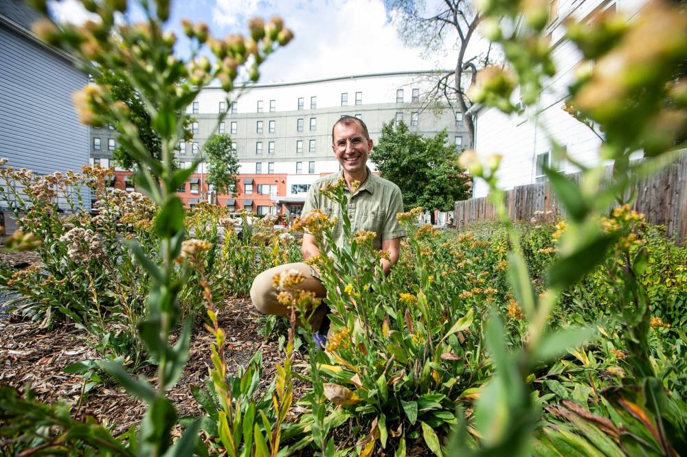 MIKAELA MACKENZIE / FREE PRESS
                                Rafael Otfinowski, U of W biology associate professor, at the Langside Learning Garden (which is planted with native plants). He says there’s immense flexibility in nature.