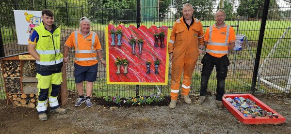 Staff from Murphy International working in the garden