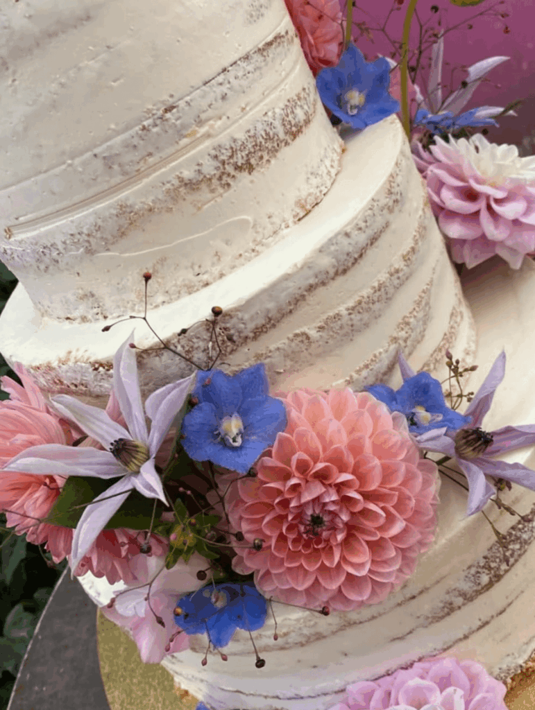 What are the blue flowers on this cake?