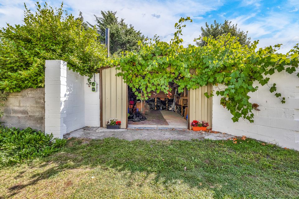 Both garden areas have large garages