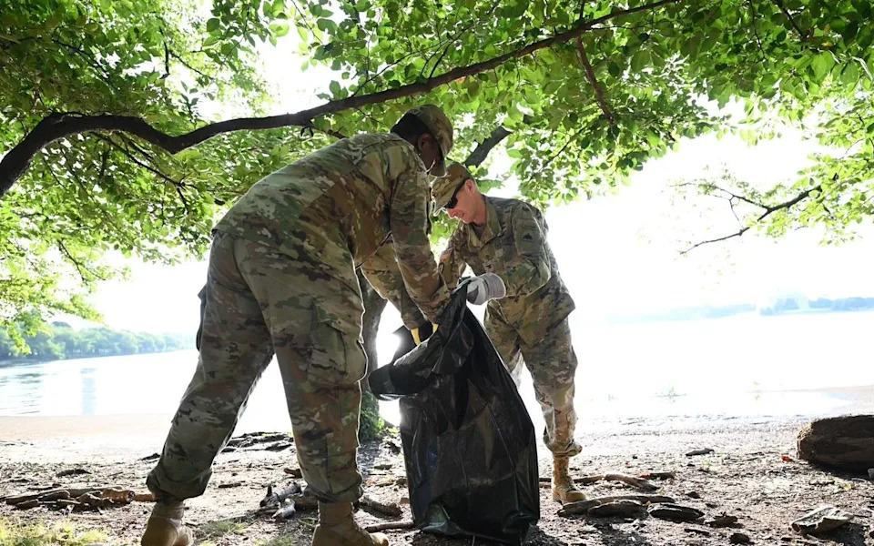 Troops begin 'beautification' efforts by collecting bags of rubbish