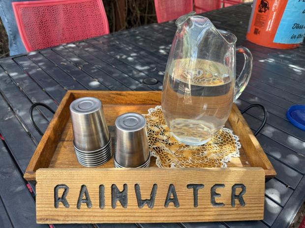 A pitcher of rainwater appears for visitors touring the nonprofit Watershed Management Group in Tucson, Ariz., on July. 19, 2025. (Anita Snow via AP)