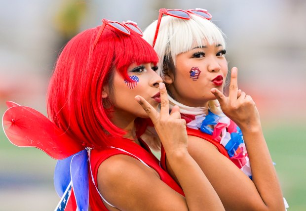 Garden Grove High cheer team members Melissa Valdovinos, left, and...