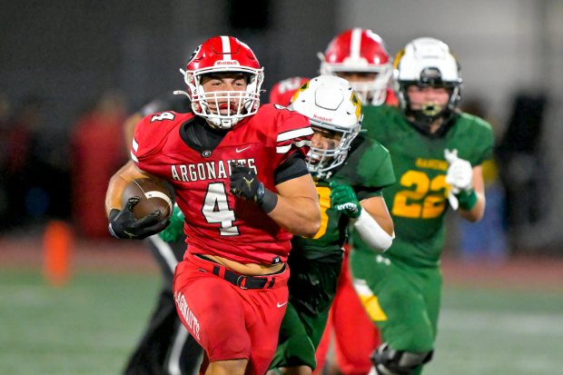 Quentin Pacelli (4) of Garden Grove runs for long yardage...