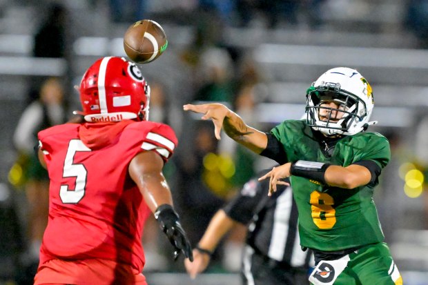 Rancho Alamitos quarterback Vincent Gentile (6) gets a pass off...