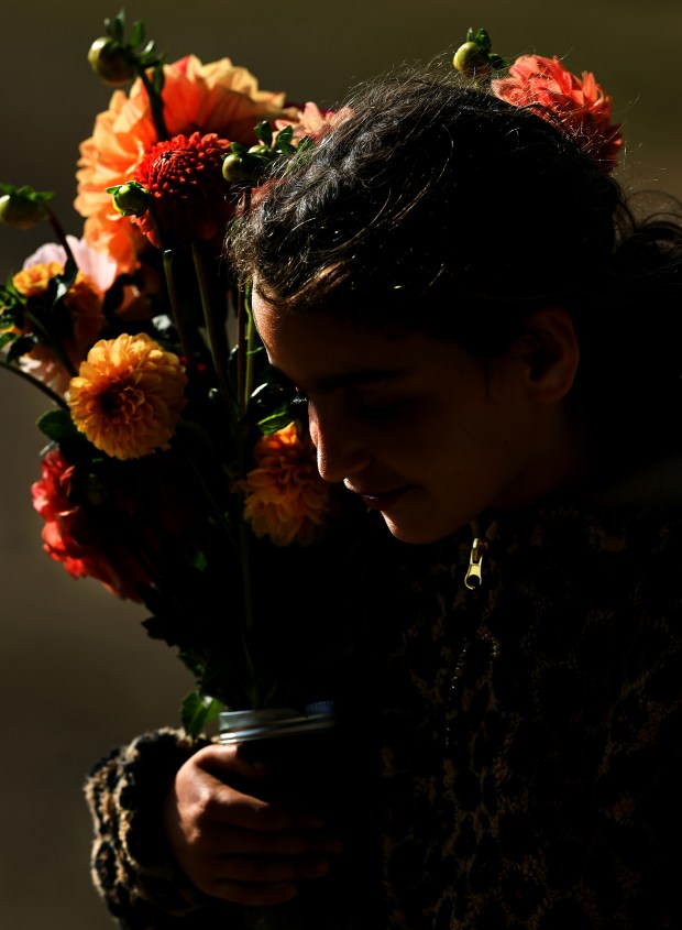 Lillian Silverberg, 9, with freshly picked flowers at Front Porch...