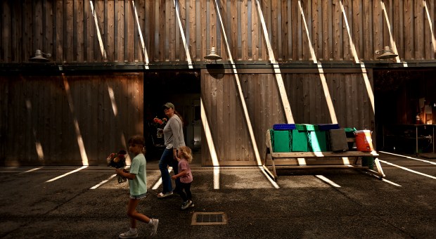 Shafts of sunlight filter through a barn at Front Porch...