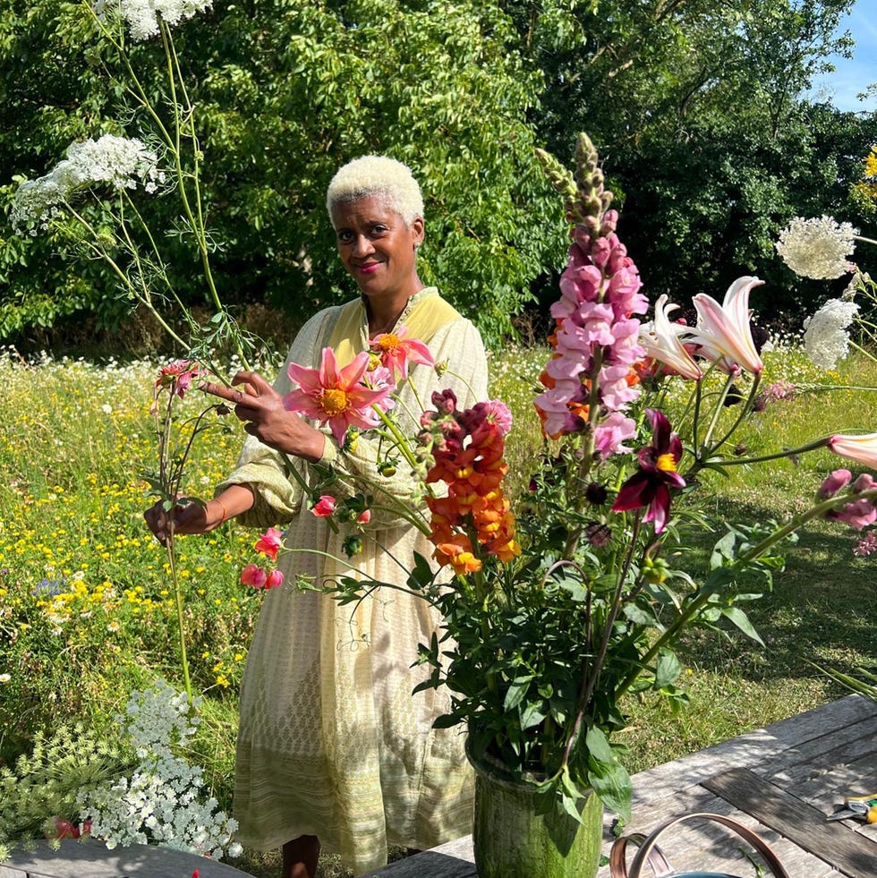 arit anderson outside with flowers