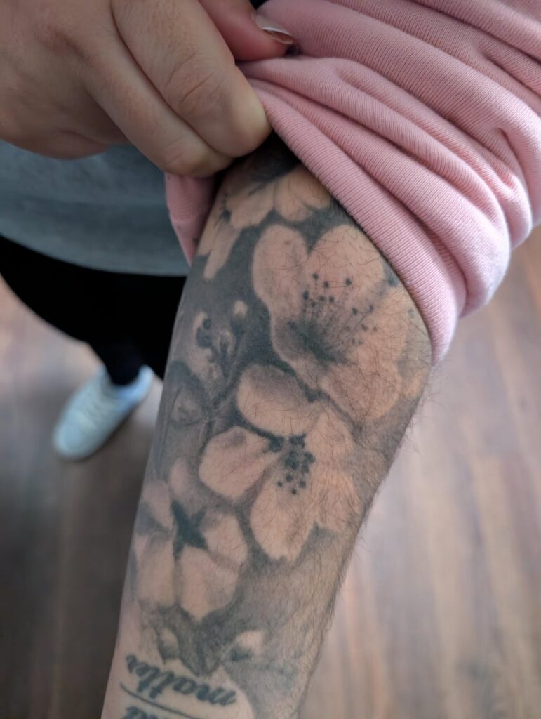 I need help identifying the flowers in this tattoo. I would like to surprise her with a bouquet of them if possible.