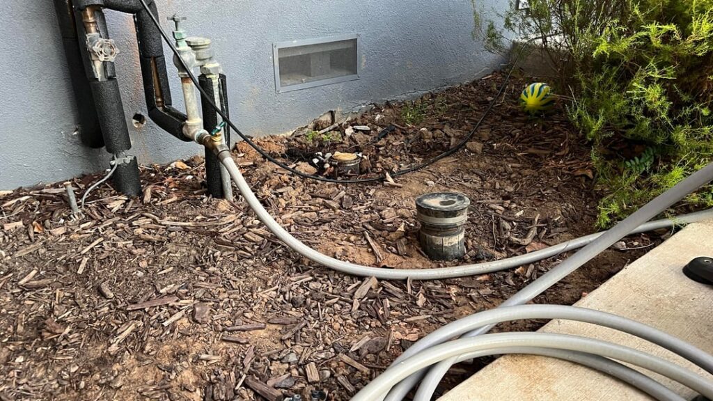 How to Regrade Soil Toward Drain Spout to Prevent Water Seepage Under House?