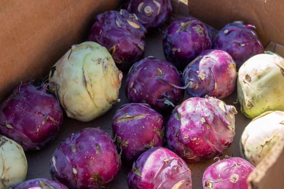 A close-up of produce in a cardboard box.