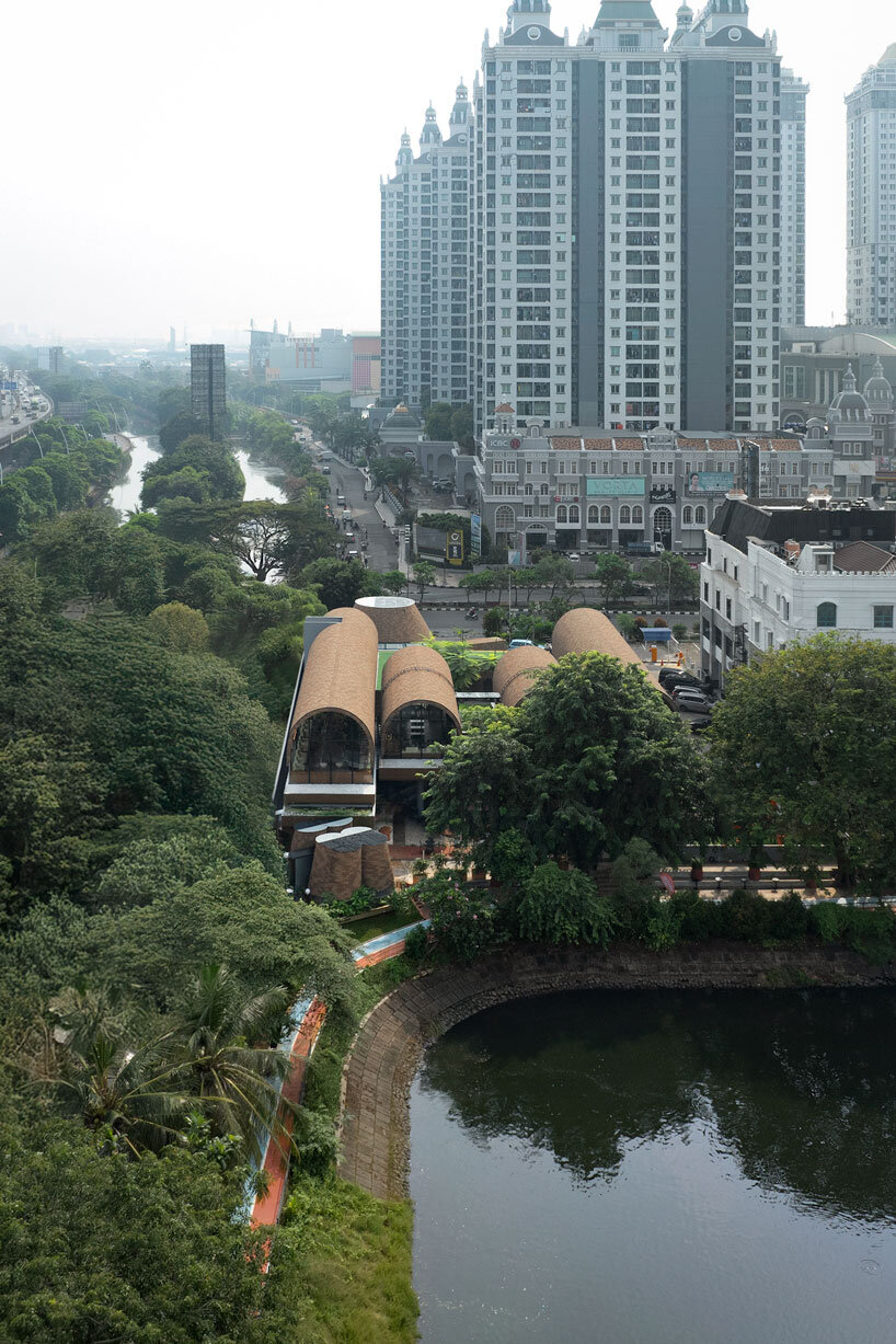 four arched shelters by RAD+ar expand upon layered sloped garden in north jakarta
