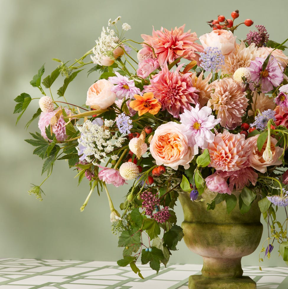 a romantic floral arrangement in pinks and peaches and soft greens