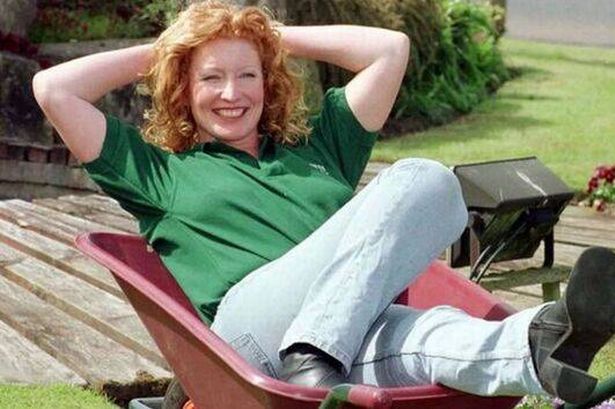 Charlie Dimmock relaxing in a wheelbarrow