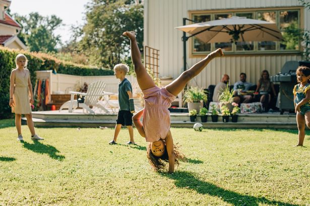 Children playing in garden in summer