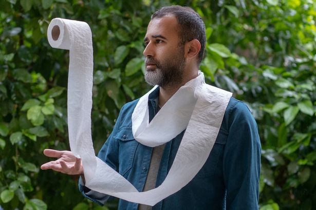 Man juggling with toilet papers at the garden