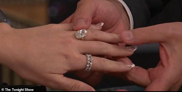The pop star, 35, revealed that her NFL fiancé was holding on to the massive sparkler for quite some time before officially popping the question
