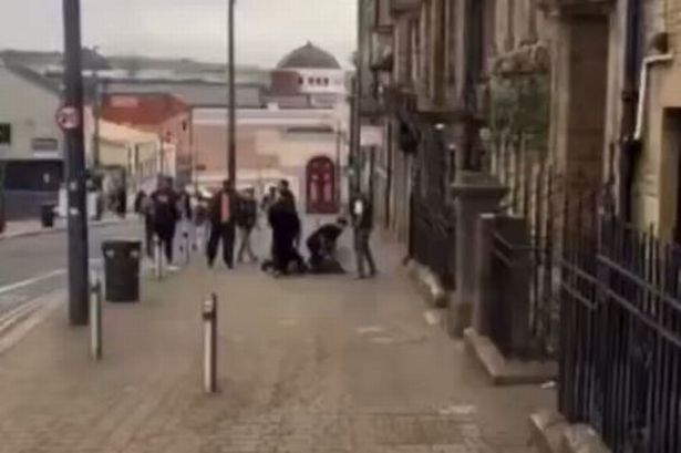 The suspect was arrested at the scene outside the college