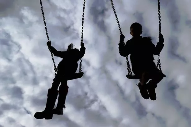 children enjoying playing on swings