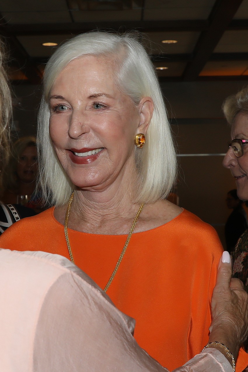 Mary Ann Meyer receives a quick hug from Sherry Koski.