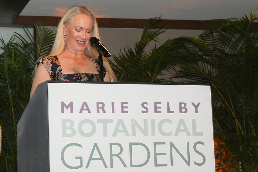 Co-chair Ariane Dart introduces the program.