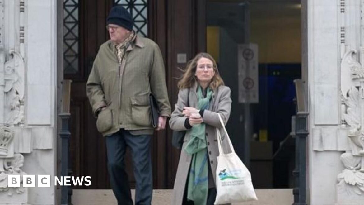 Monmouthshire couple cleared over gardener’s quad bike death A woman and a man coming down steps outside Newport Crown Court. The man, on the left, wears dark blue trousers and a khaki coat, and a dark blue woolly hat. The woman, on the right, wears a grey coat and green patterned scarf; she carries a tote bag.