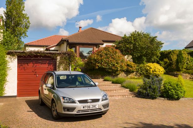 Car parked outside bungalow