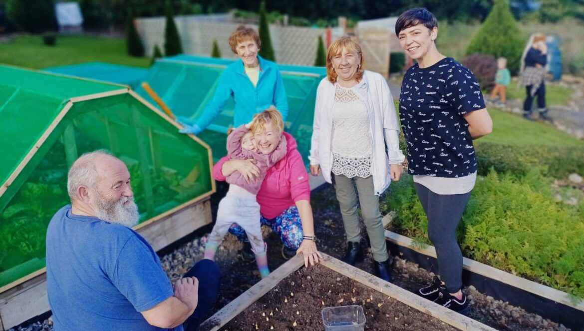 Local Notes: Hard at work at Charlestown Organic Community Garden. - Community