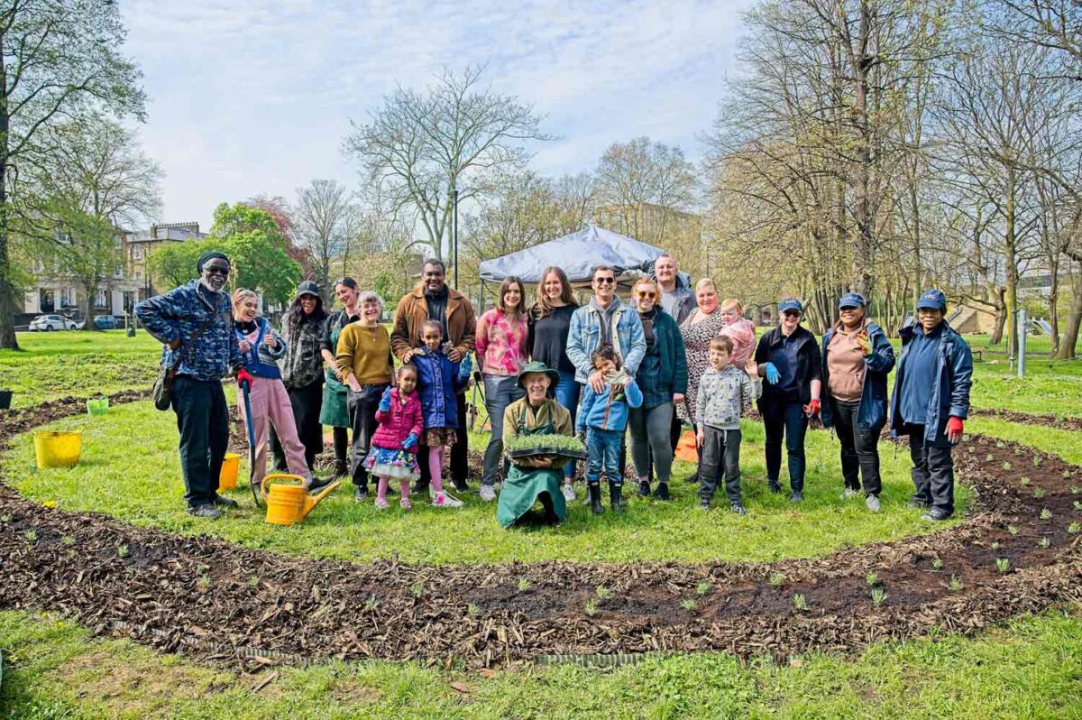 group poses for photo in park area