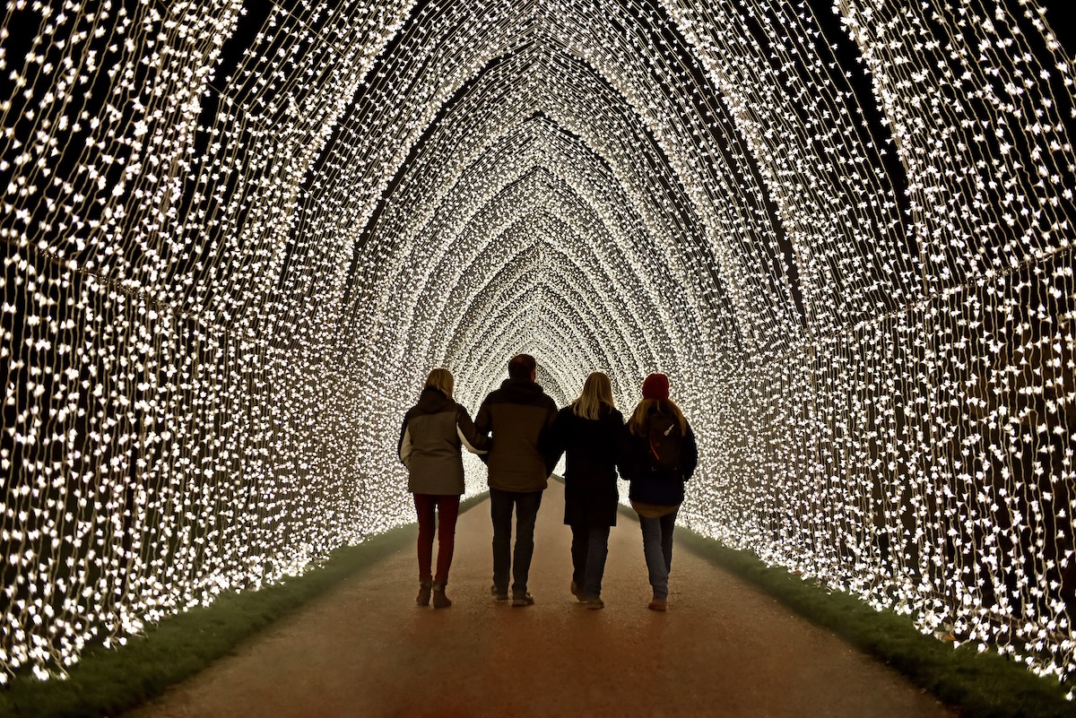 people in a tunnel of lights