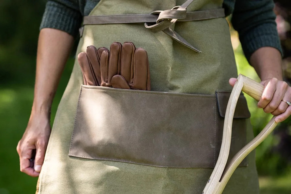 A waterproof garden apron is an essential buy for winter gardening (PA)