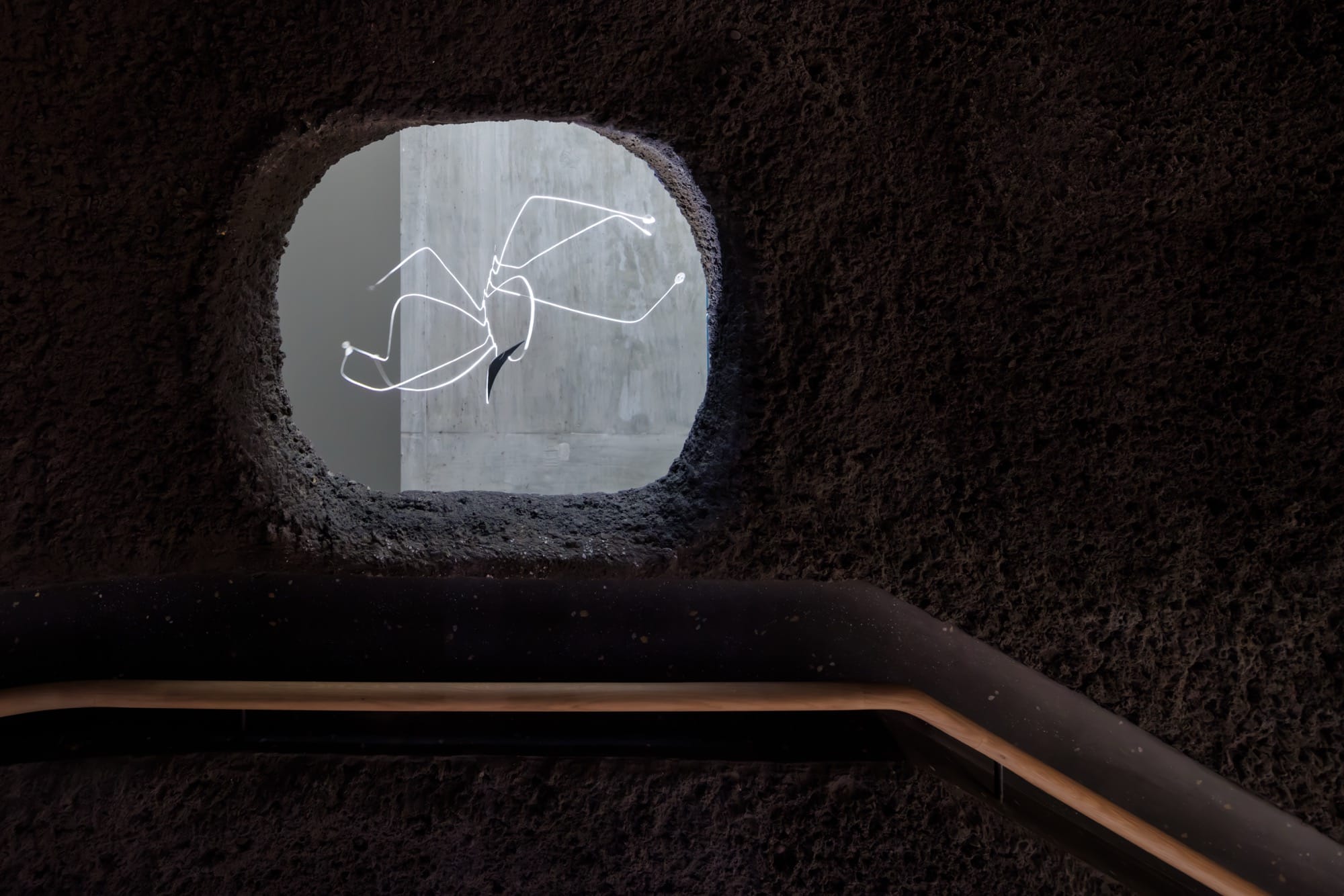 an architectural opening at Calder Gardens with a hanging spider like sculpter