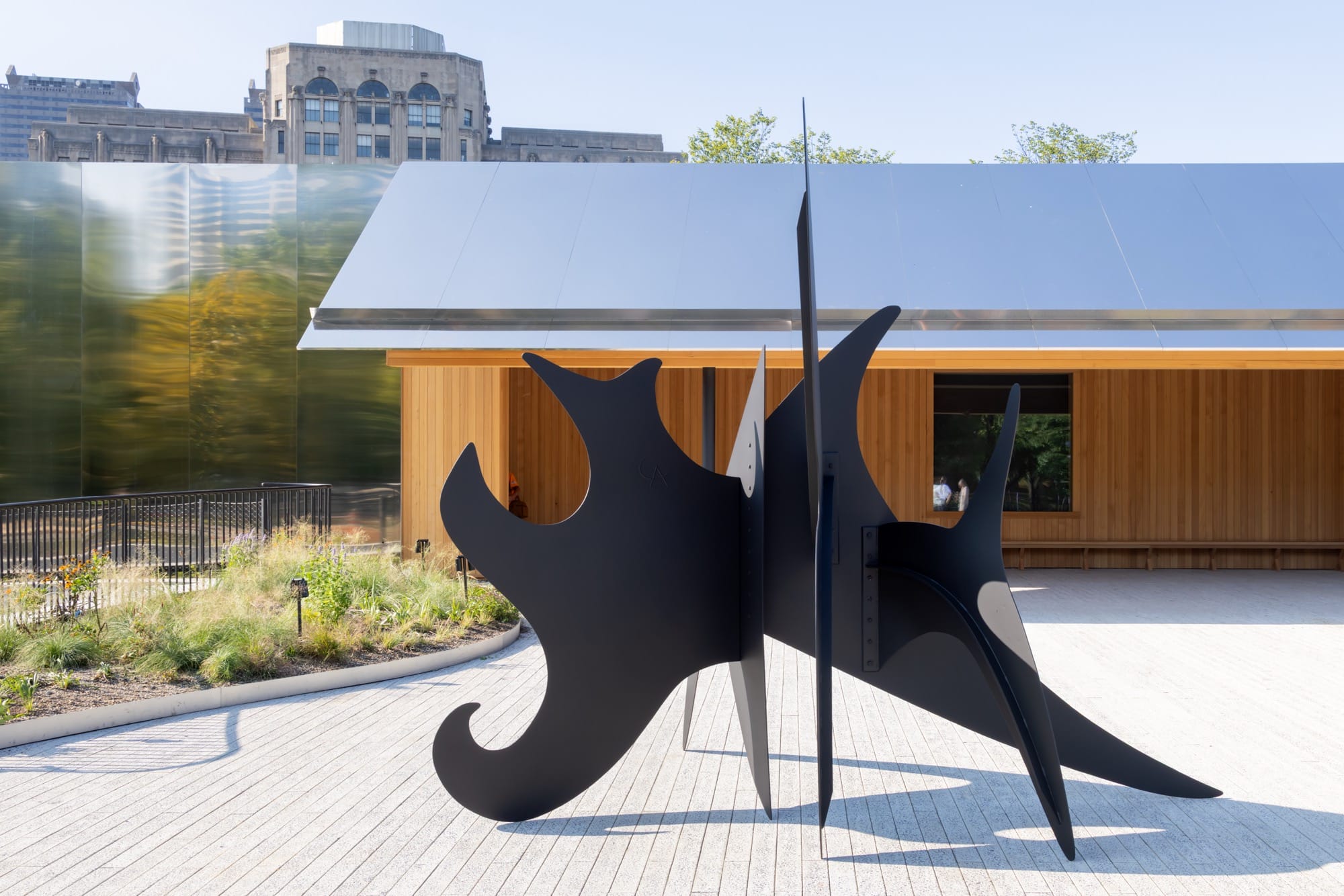 a large black Alexander Calder sculpture outdoors