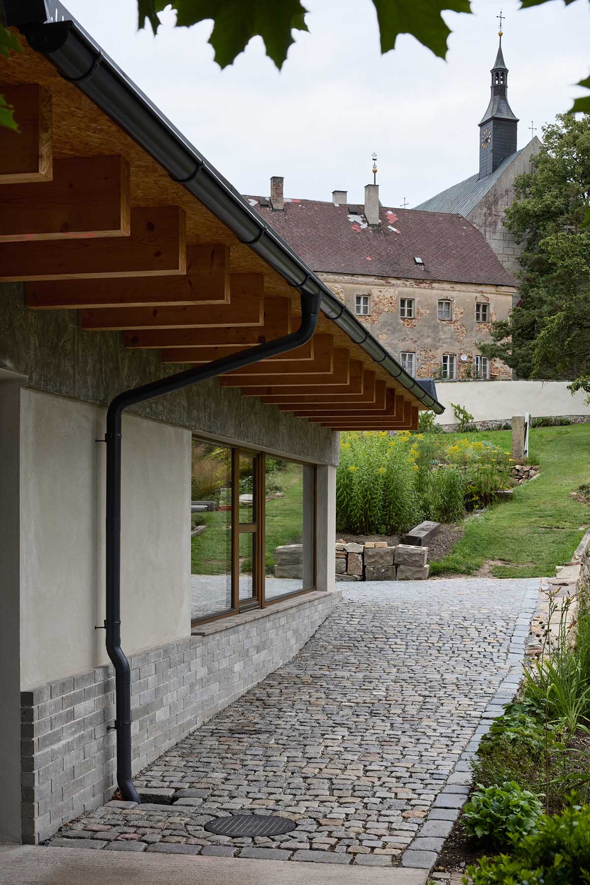 matěj šebek architekti transforms Kraffer Garden into a contemporary community space 