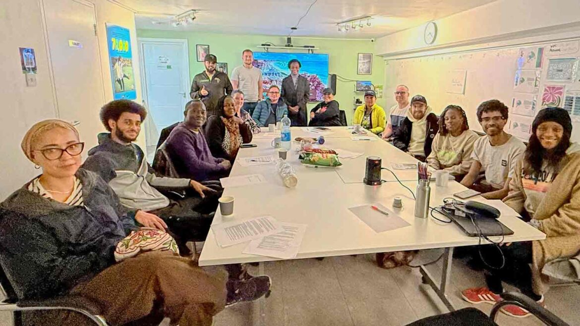 Campaigners plan ‘Brixton’s beautiful front garden’ people round table at a meeting