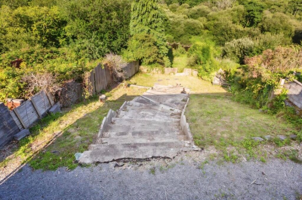 Can anything be done to this steep sloped garden? Can anything be done to this steep sloped garden?