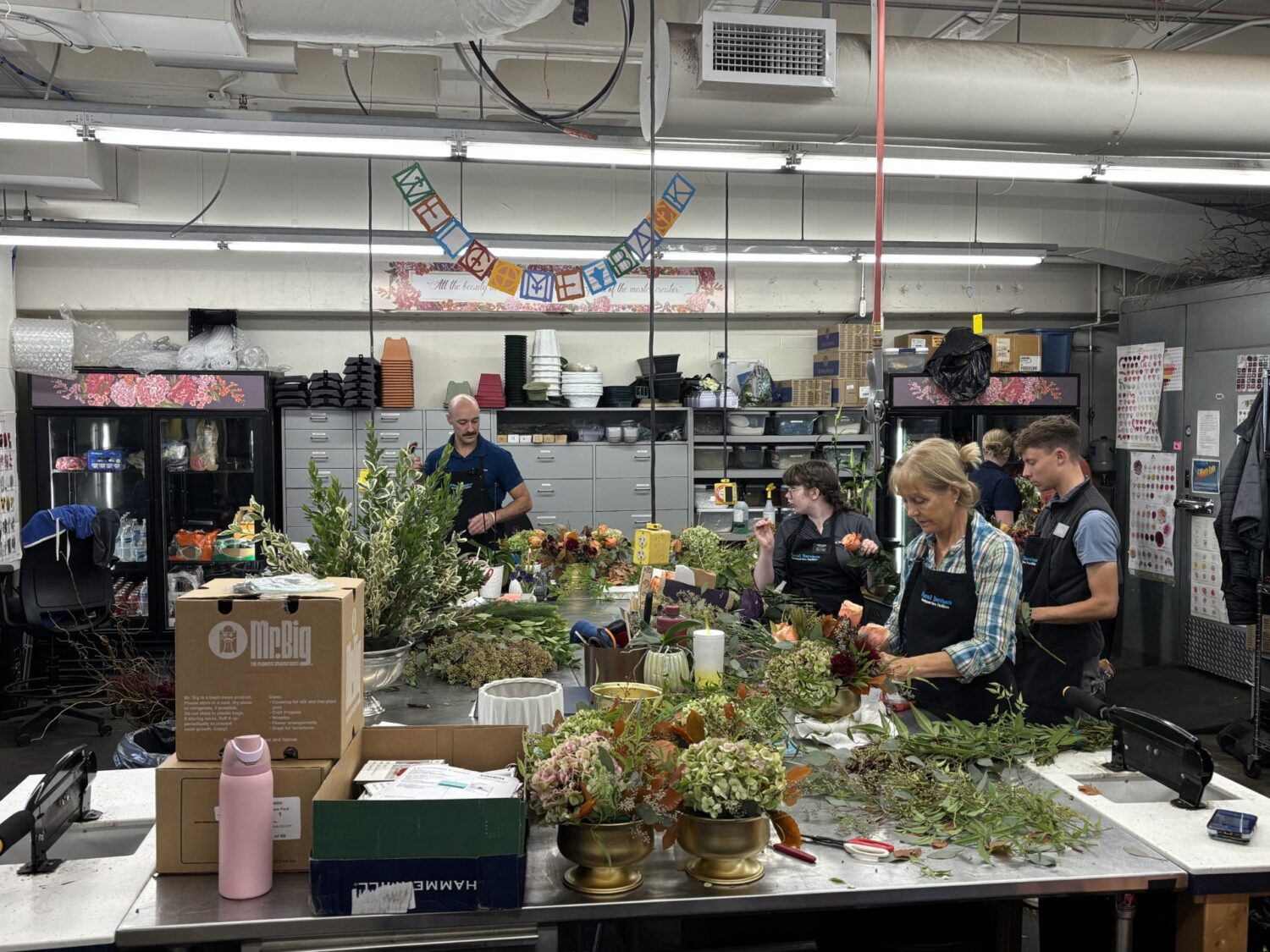 Florists prepare flowers for general conference.