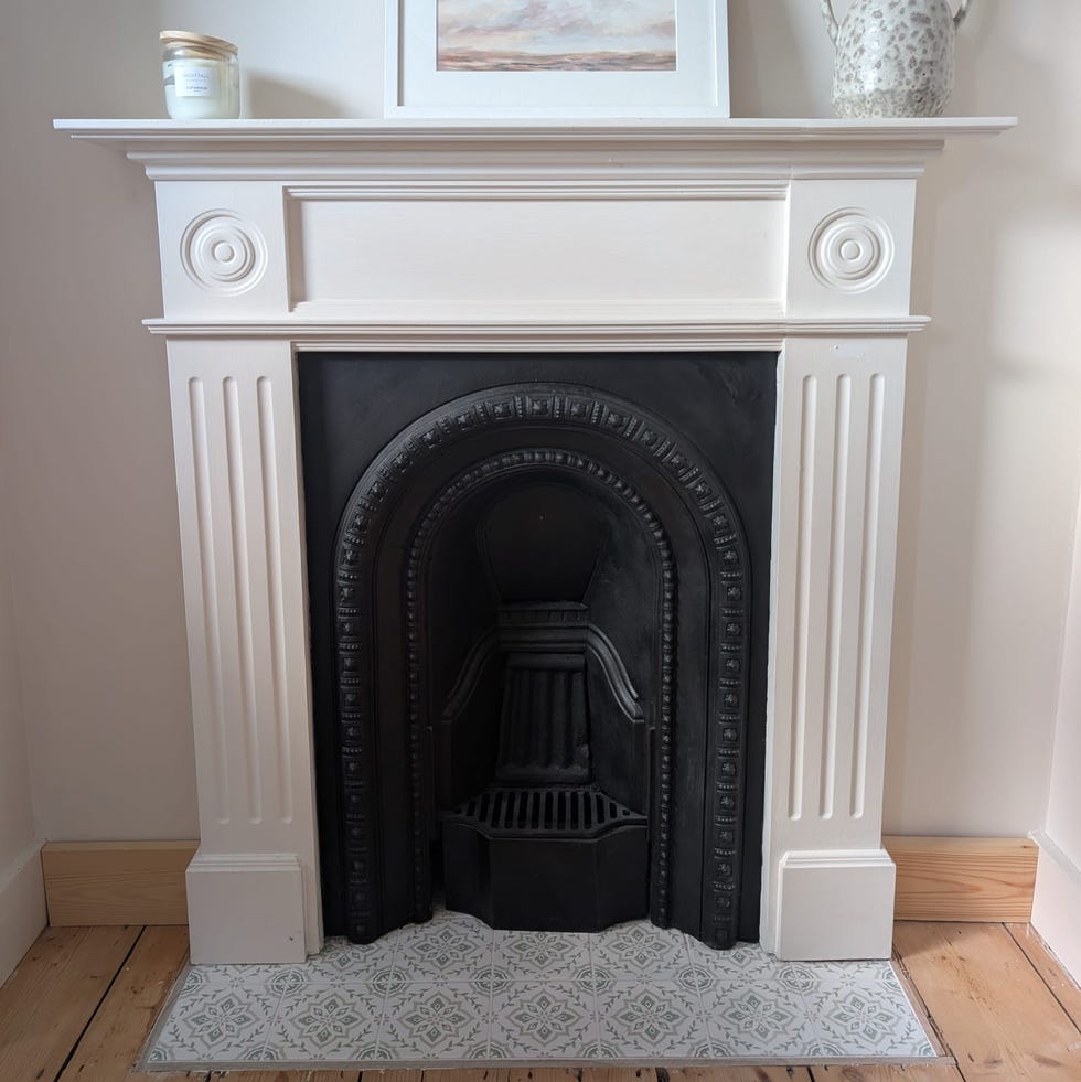 elegant fireplace with artwork and decor on the mantel