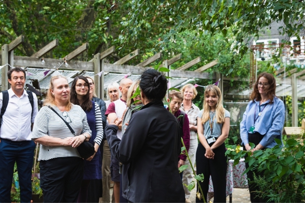 A group of people listen to a talk at the Wandsworth Sustainability Network