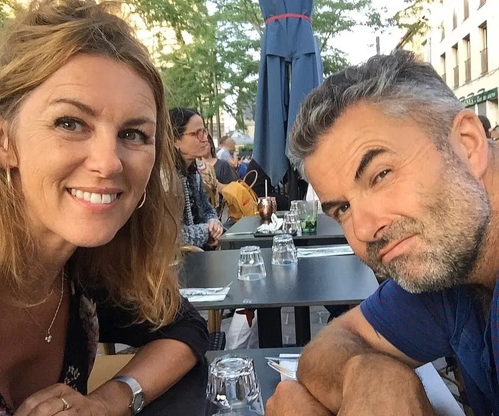 Trudi Burgess and Robert Easom sitting at a table outdoors.