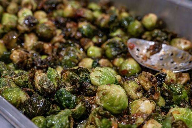 Brussels Sprouts in tray with silver spoon